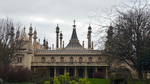 Royal Pavilion in Brighton with overcast sky backdrop and trees yet to bloom