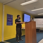 Design Systems Day kickoff with speaker by a lecturn