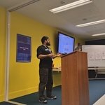 Design Systems Day kickoff with speaker by a lecturn