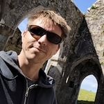 Calum with sunglasses on in a monastry