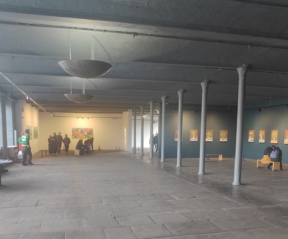 Inside a former textile mill now an empty space filled with paintings