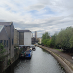 Canal in Saltaire with backdrop of factory chimney