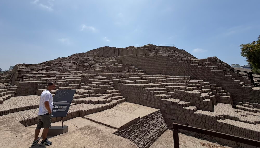 Huaca Pucllana, a large adobe pyramid in Lima under sunny blue skies.