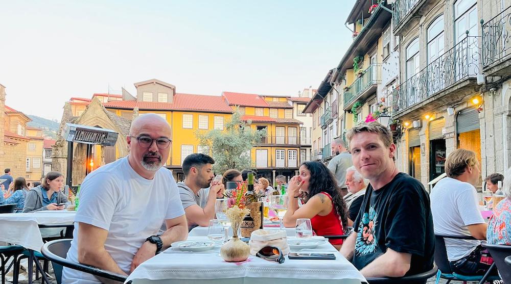 Calum and Paulo at restaurant table