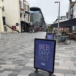 A pedestrianised street with the standing sign 