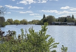 Wide river view, clear blue sky and greenery surrounding