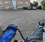 Seated view from campchair towards apartment block