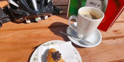 Coffee and pastry on picnic table
