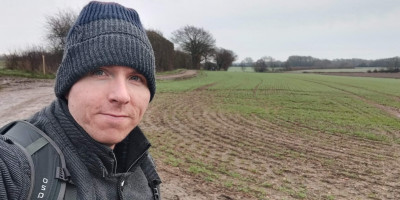 Calum standing in muddy field near Tonbridge