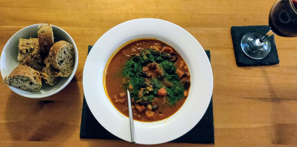 Spanish bean stew with bread and wine