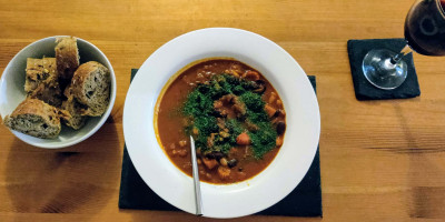 Spanish bean stew with bread and wine