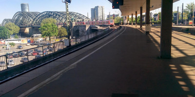 Cologne station view of bridge and RE train arriving