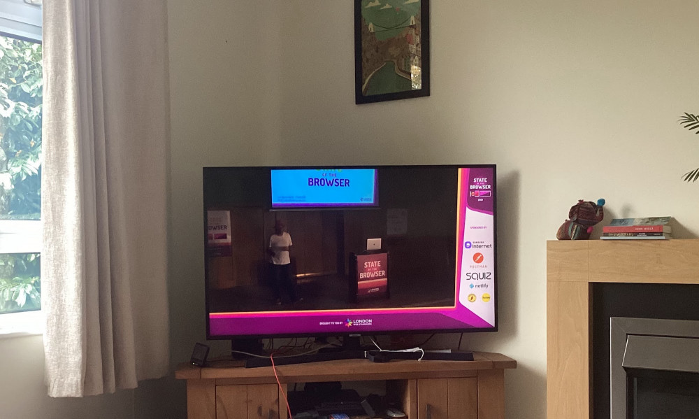 Television streaming SotB beside fireplace and framed painting behind of Clifton suspension bridge