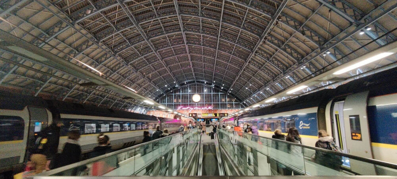 Night time London St Pancras terminal shot with two trains and station clock