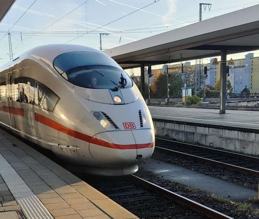 Front of ICE train arriving at station on clear morning