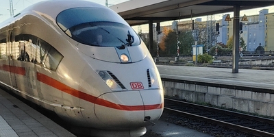 Front of ICE train arriving at station on clear morning