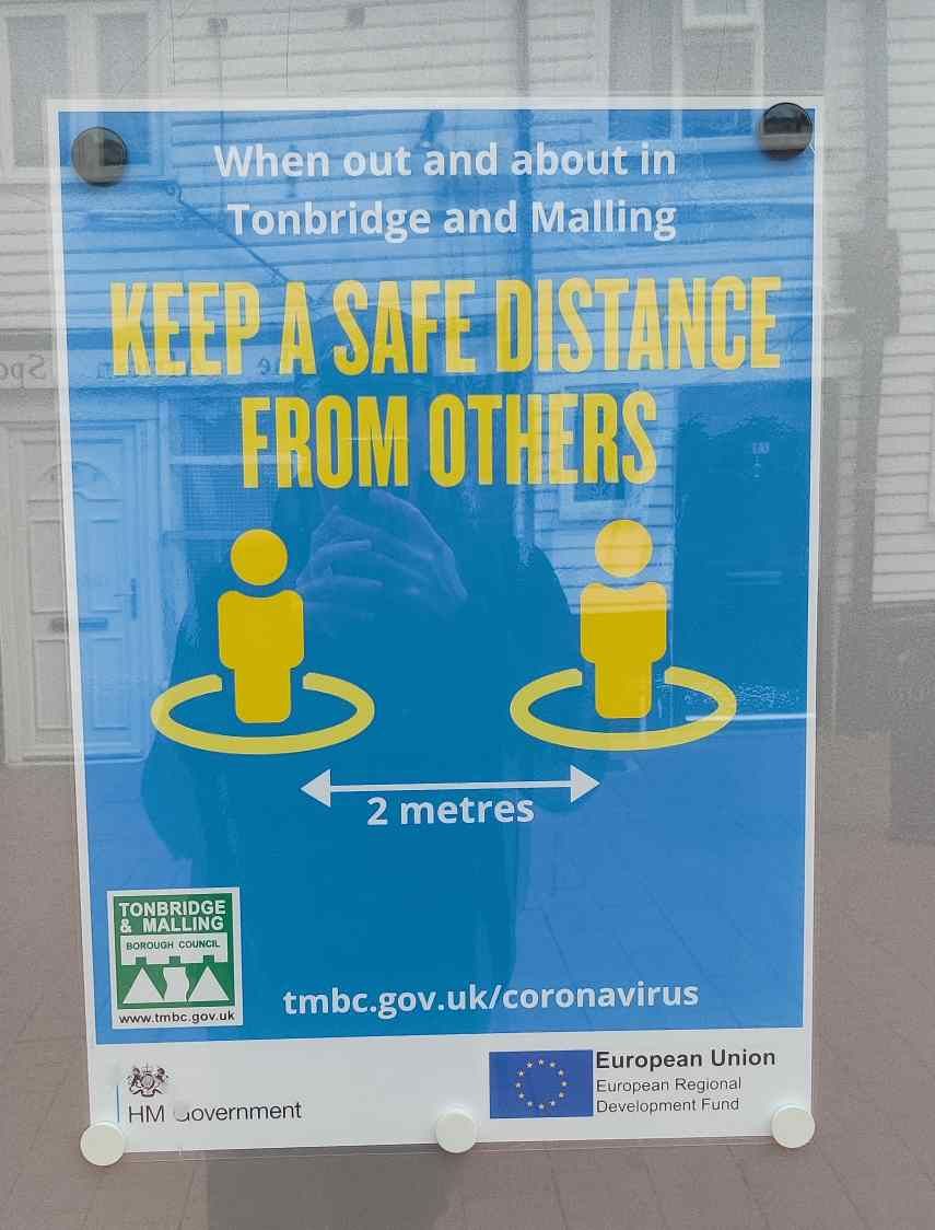 Poster in Tonbridge warning on 2 metre distancing with EU logo