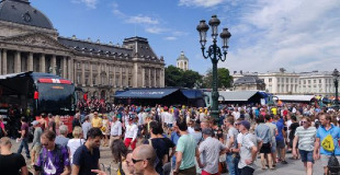Crowds surrounding Le Tour team coaches outside in Brussels