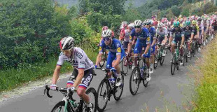 Cyclist racing in the Prudential Classic race at Box Hill in Surrey