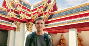 Calum standing inside Way Pho, Bangkok