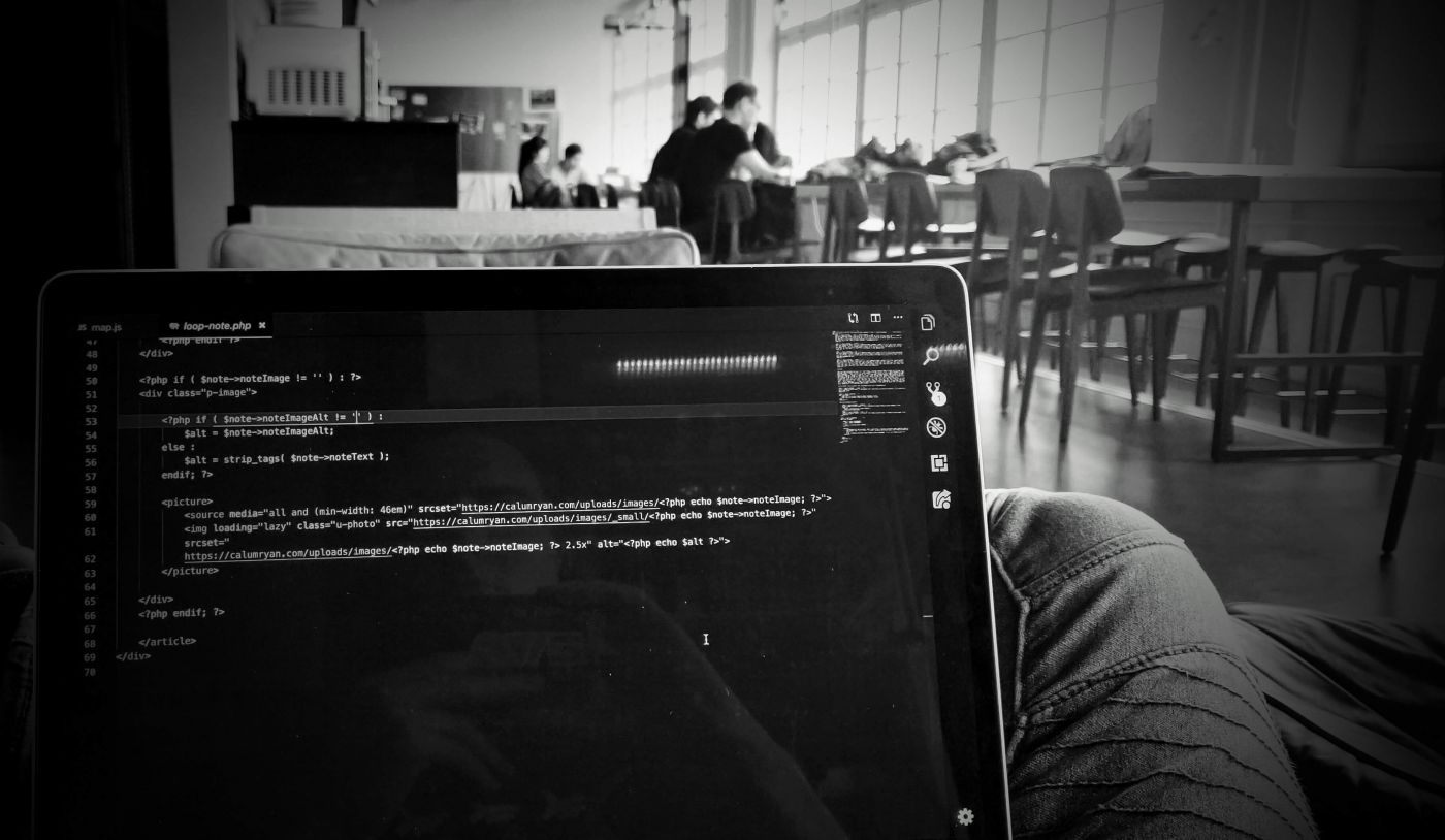 Coding on a laptop screen inside at Mozilla Berlin